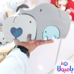 قطعات جداشده جورچین فیل روی سطح صاف
